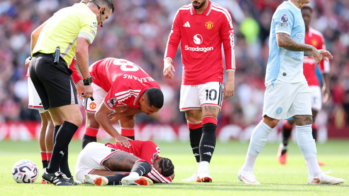 Picture of Youri Tielemans comforts injured Marcus Rashford